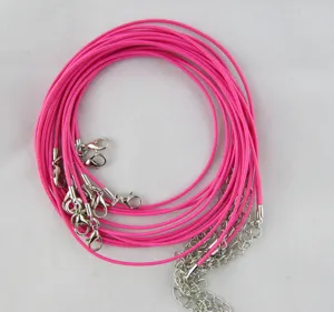 Close-up of hot pink wax necklace cords with silver lobster clasps for DIY jewelry