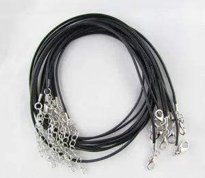 Close-up detail of black waxed necklace cords with silver lobster clasps for DIY jewelry