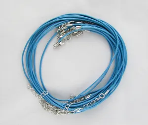 Detail view of blue waxed necklace cords with silver lobster clasps for DIY crafts