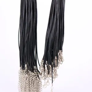 Detailed view of bulk black wax cords for DIY necklaces with silver metal lobster clasps