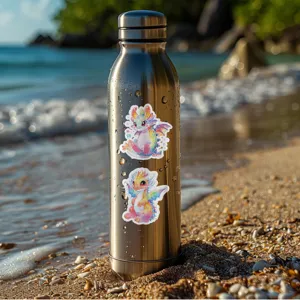 Stainless steel water bottle decorated with cute rainbow dragon stickers on beach background detail.