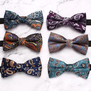 Detail view of men's paisley bowties collection, elegant geometric floral pattern for formal wear.