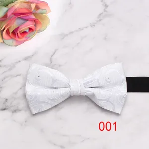 Detailed view of white floral geometric men's bow tie with black strap for formal business suits.