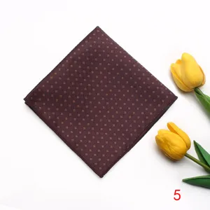 Men's dark brown jacquard pocket square with geometric pattern for formal wear and suits.