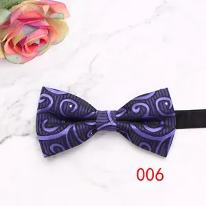 Purple geometric pattern men's formal bow tie detail shot, perfect for wedding suit accessories.