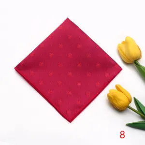 Red jacquard pocket square with floral pattern detailed close up view for formal men suits.