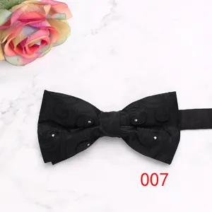 Men formal black bow tie with geometric pattern and crystal details for wedding suit detail.