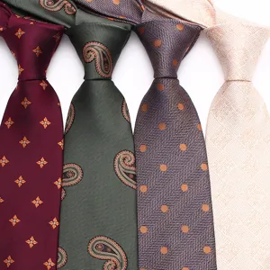 Detailed close-up of classic 8cm men's ties featuring paisley, geometric, and herringbone patterns.