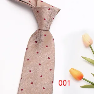 Men's business polka dot jacquard tie detail, elegant champagne silk necktie for suit wear.