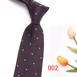 Men's brown blue polka dot jacquard tie detail, classic business suit necktie accessory.