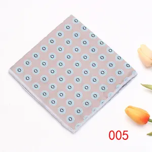 Classic men's pocket square with elegant blue geometric medallion print on beige fabric.