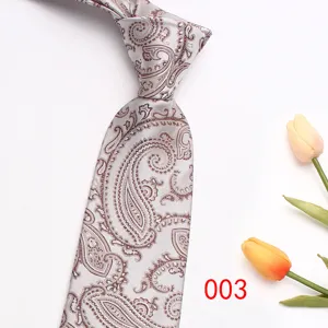 Detail shot of grey paisley jacquard men's necktie closeup texture fabric wedding business style.