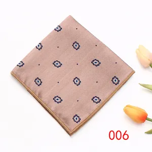 Detailed view of beige pocket square with floral pattern, ideal for formal business suits.