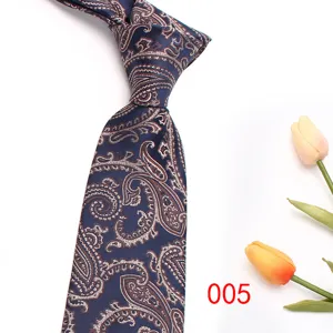 Detail shot of navy blue paisley silk tie, elegant jacquard pattern for formal business wear.
