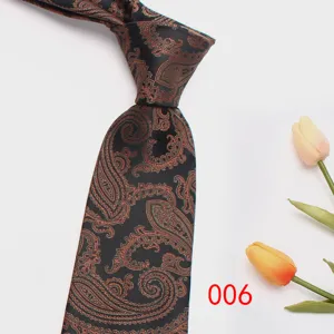 Detail view of the classic black paisley jacquard men's necktie, elegant business suit accessory.