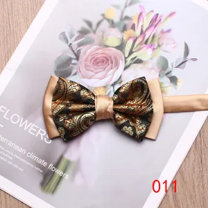 Elegant men's double-layer bow tie with stylish gold and black paisley pattern for weddings.