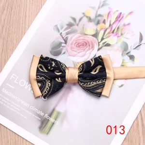 Men's two-tone paisley bow tie, elegant blue and gold color block design for wedding party.