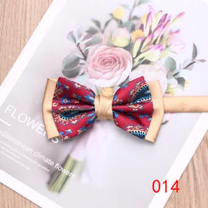 Men's two-tone paisley bow tie with gold border, elegant wedding and formal wear item.