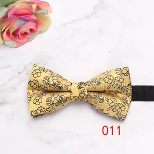 Gold floral bow tie detail, elegant pattern texture close-up for formal business wear.