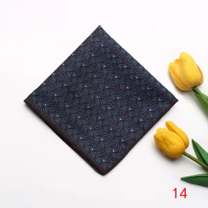 Detailed shot of a dark blue jacquard pocket square with paisley pattern for formal events.