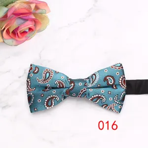 Detailed view of turquoise paisley bow tie with elegant floral pattern for formal wear.