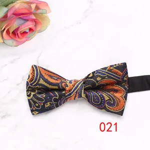 Men business paisley pattern bow tie detail view, elegant formal suit wedding accessory.