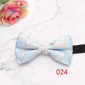 Detail view of the blue and gold paisley bow tie, featuring elegant floral pattern for suits.