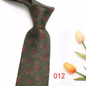 Men's green paisley tie detail shot, showing exquisite jacquard texture and elegant business style.