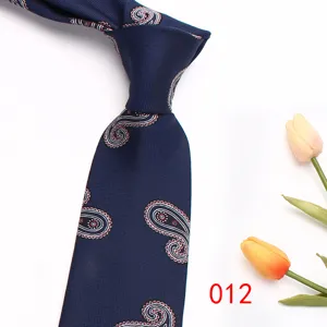 Close-up detail of the classic navy blue paisley pattern men tie with exquisite weaving texture.