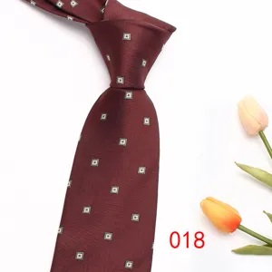 Burgundy red men's woven necktie featuring elegant geometric square pattern, business suit detail.