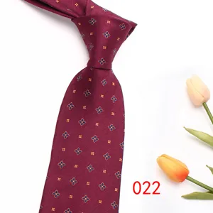 Burgundy silk-blend mens necktie with elegant blue and gold floral jacquard pattern detail.