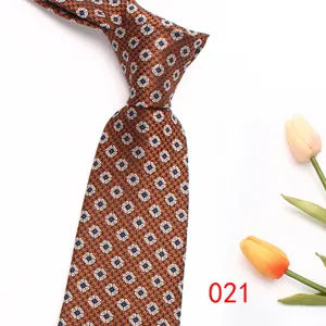 Brown geometric patterned men's tie, classic business style with elegant floral motifs.