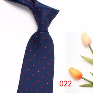 Classic men's navy blue necktie featuring elegant red geometric dot pattern for business wear.