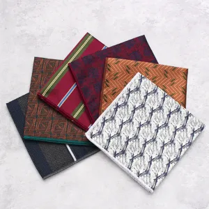 Close-up detail of assorted patterned pocket squares, classic suit accessory and handkerchief.