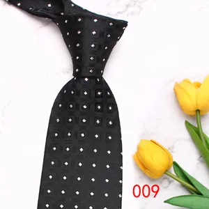Black geometric patterned men's tie, vintage style polyester business necktie accessory.