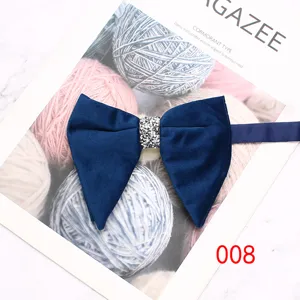 Men's deep blue velvet horn bow tie with sparkly rhinestone center, elegant suit and shirt accessory.