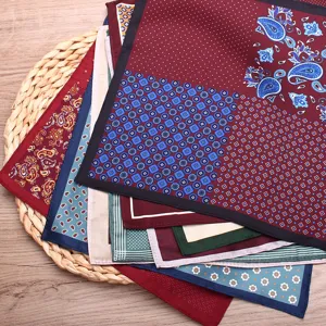 Detailed view of men's silk pocket squares featuring classic paisley and polka dot prints.