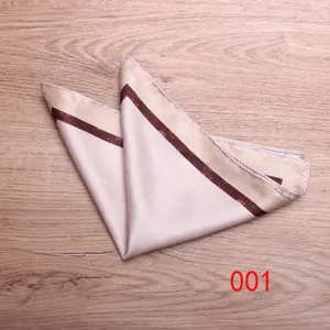 Detailed view of men's pocket square with elegant printed border, perfect suit accessory.