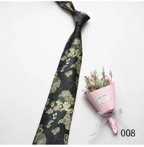 Detailed view of men vintage floral patterned tie in dark green with exquisite gold botanical design.