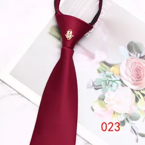 Burgundy wedding zipper necktie with gold double happiness pin, smooth fabric, detail view.