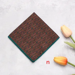 Men formal business suit pocket square handkerchief with dark green orange geometric pattern detail.