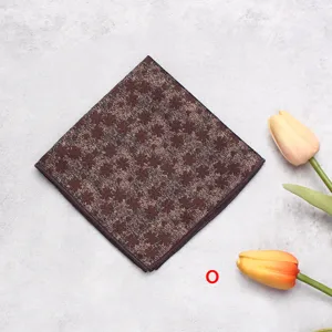 Brown four-leaf clover pocket square for men, elegant suit handkerchief accessory.