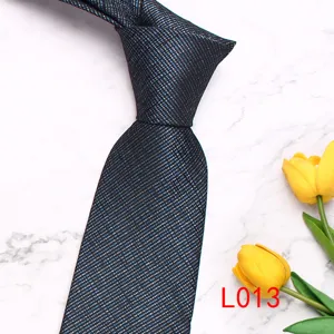 Detail view of a classic men's business tie featuring a fine diagonal stripe woven texture.