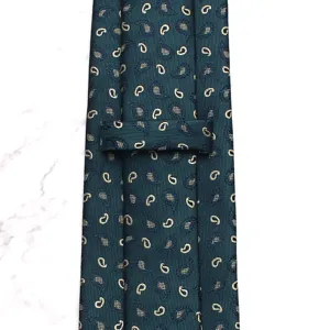 Dark green men's necktie with elegant paisley pattern, close-up detail view of textured fabric.