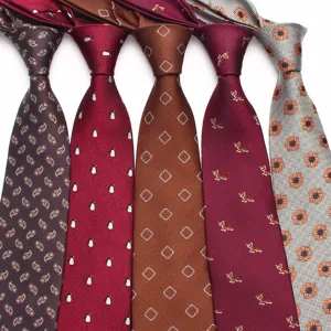 Detailed view of men's woven silk business neckties in assorted patterns and colors for formal wear.