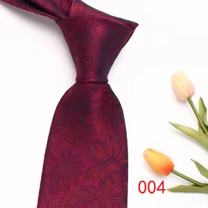 Detailed view of a burgundy floral woven men's tie, elegant business necktie accessory.