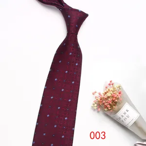 Burgundy men's business tie featuring elegant blue floral patterns. Perfect for formal wear.