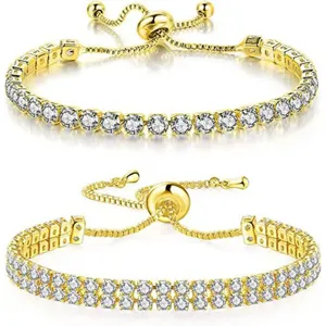 Comparación de pulseras tenis doradas de una y dos hileras con circonitas blancas.