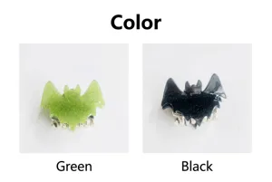 Detailed view of bat-shaped hair clips in glittery green and black colors for Halloween