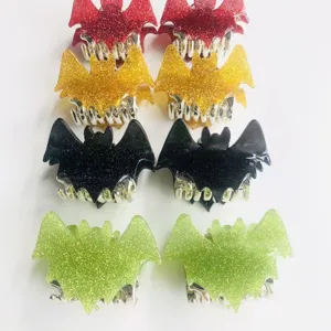 Close-up of glitter bat hair claws in multiple colors